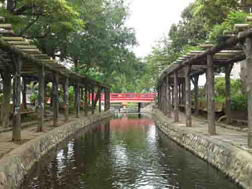 a red bridge over Furukawa Water Park