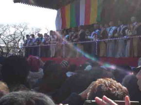 many people throwing beans in setsubun